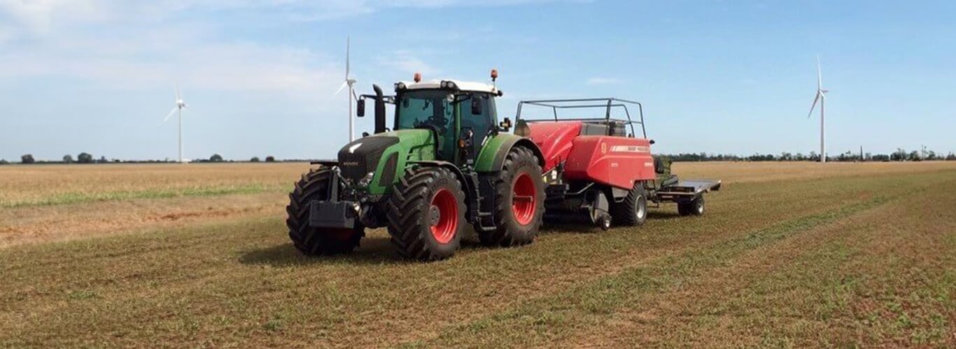 Fendt pulling a square baler and trailer.